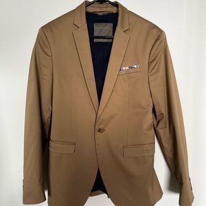 Tan suit with stitched in pocket square